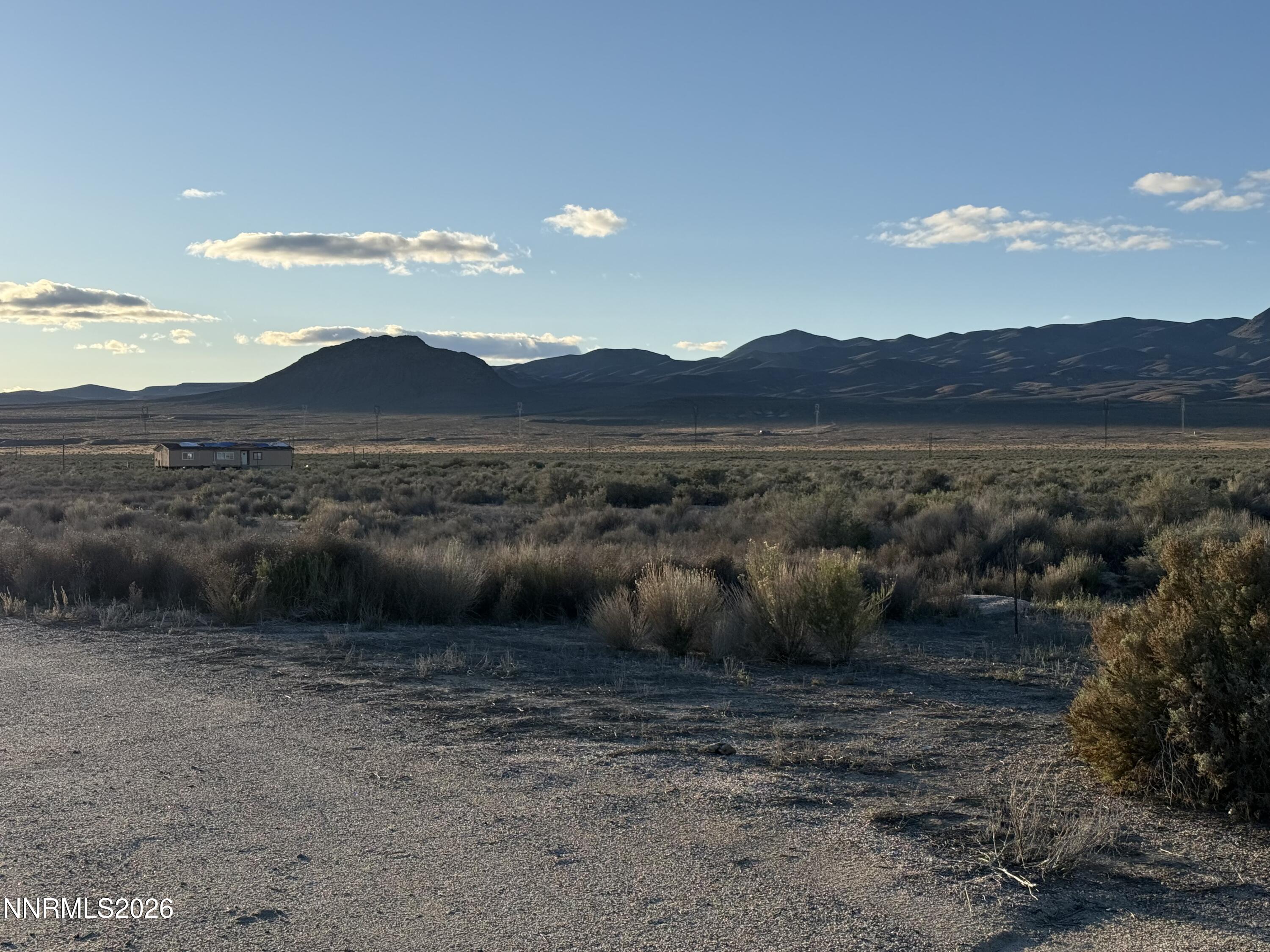 5105 North Meridian Road Lovelock, NV 89419 - Photo 1 of 6 a view of a lake with mountain