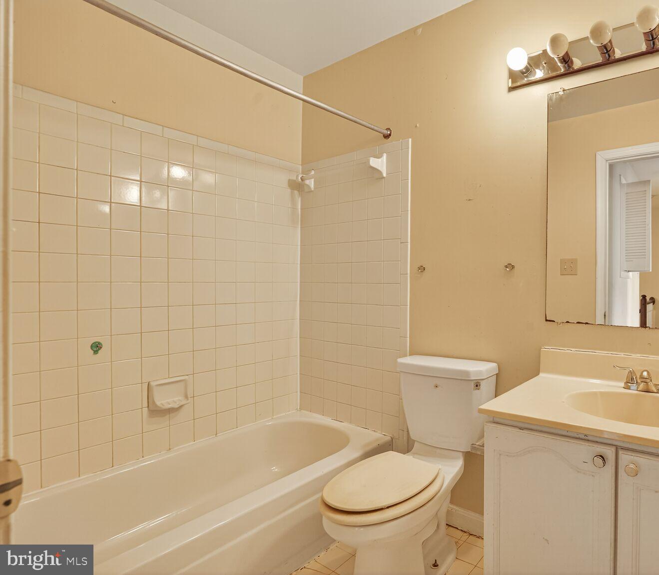13920 Baton Rouge Court Centreville, VA 20121 - Photo 20 of 24 a white toilet sitting next to a bath tub