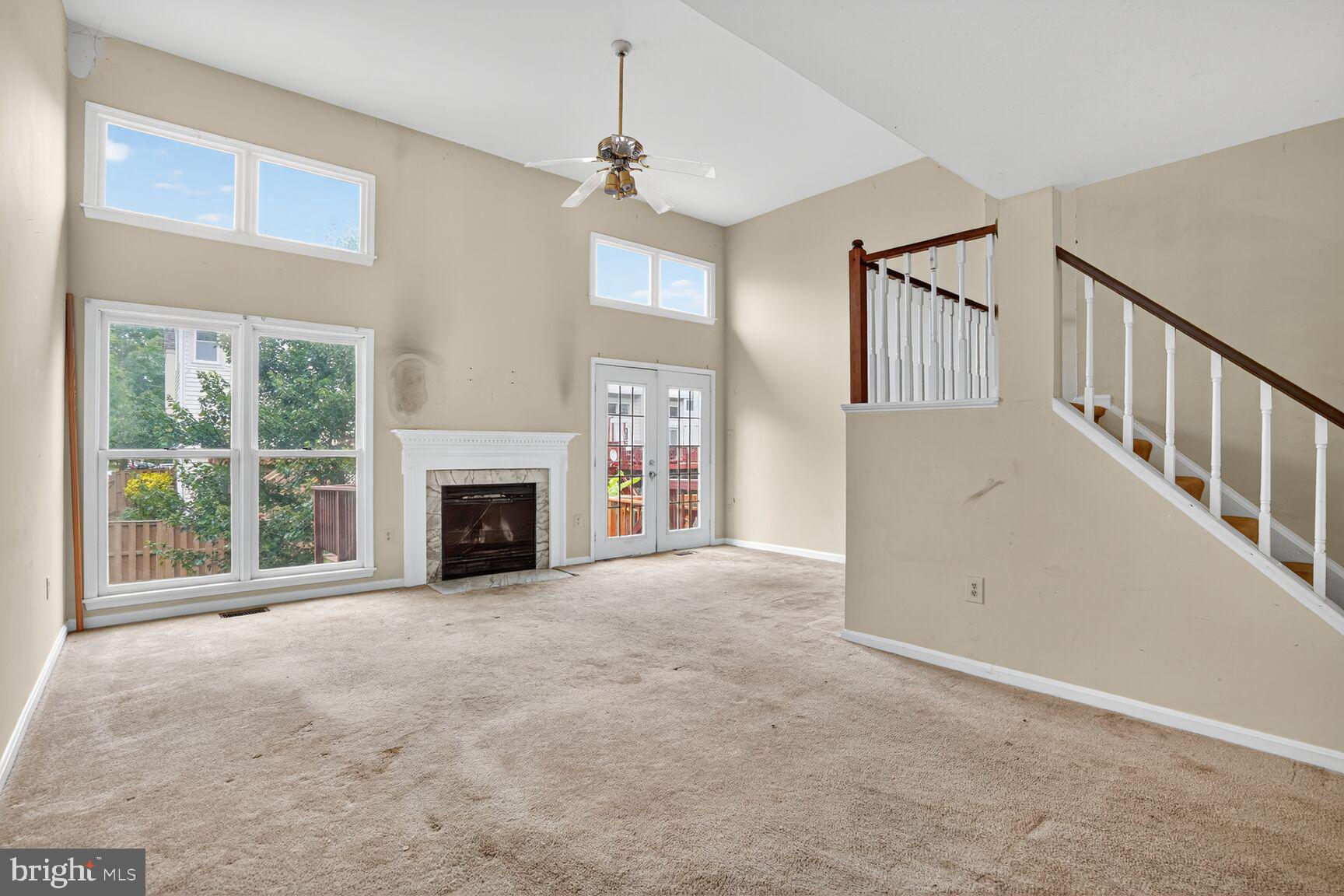 13920 Baton Rouge Court Centreville, VA 20121 - Photo 8 of 24 a view of an empty room with a fireplace and a window