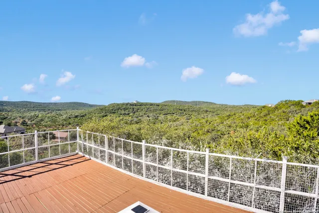a view of a balcony with an ocean view
