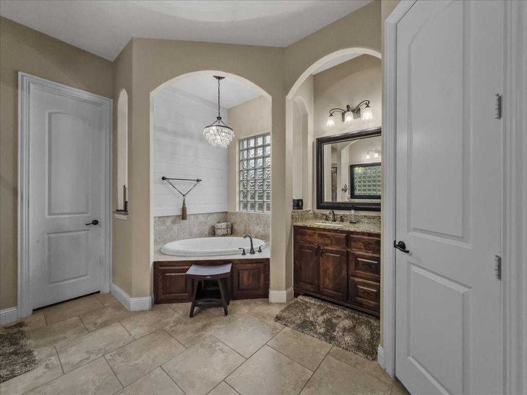 2832 Mona Vale Road Trophy Club, TX 76262 - Photo 20 of 37 a spacious bathroom with a double vanity sink and a mirror