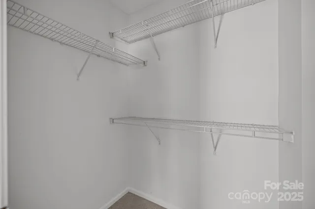 a view of a room with racks on the wall