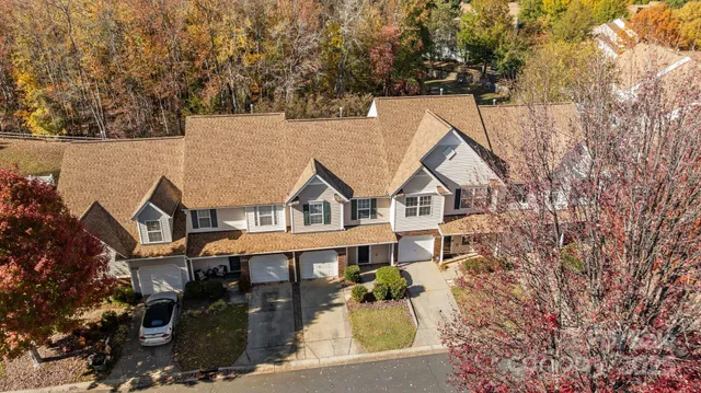 aerial view of a house with a yard