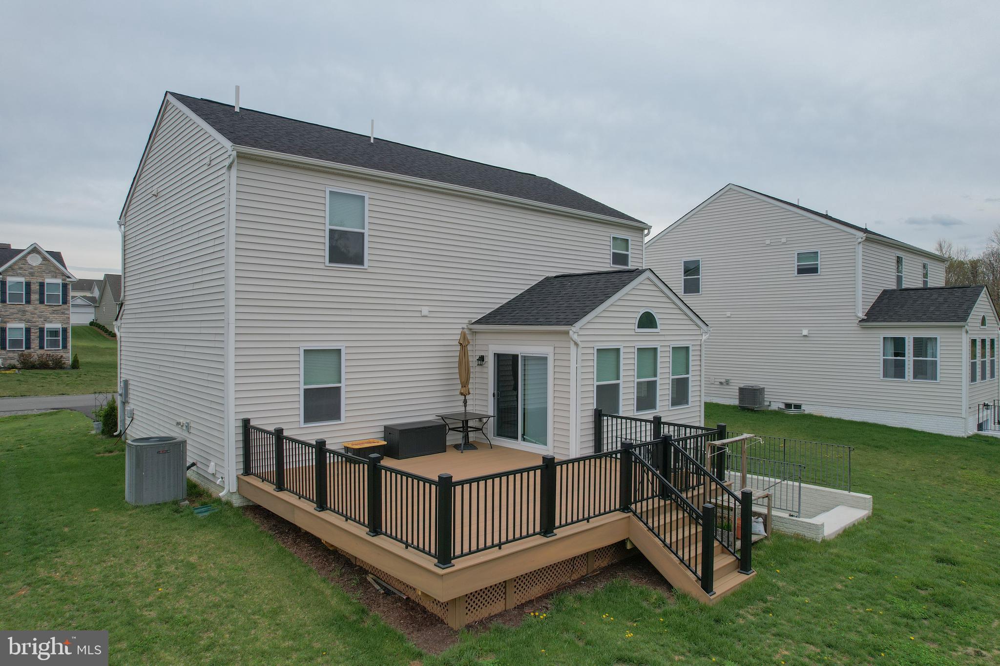 503 Boise Road Inwood, WV 25428 - Photo 68 of 83 a view of a house with backyard and sitting area