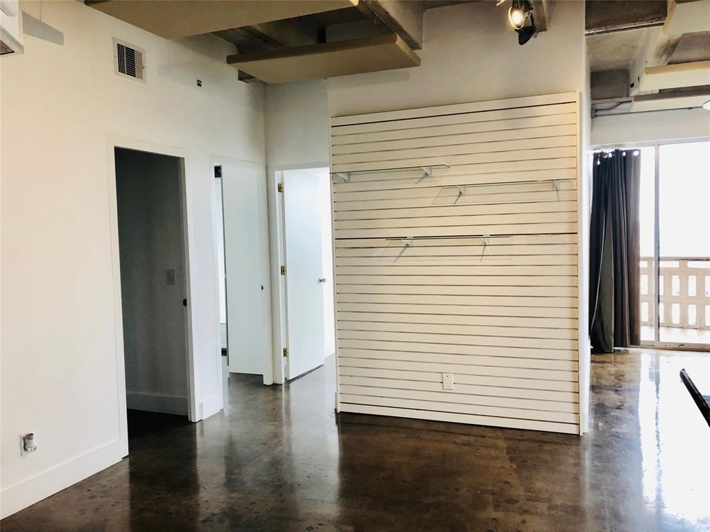 2016 Main Street, Unit 1822 Houston, TX 77002 - Photo 6 of 20 a view of a room with wooden floor