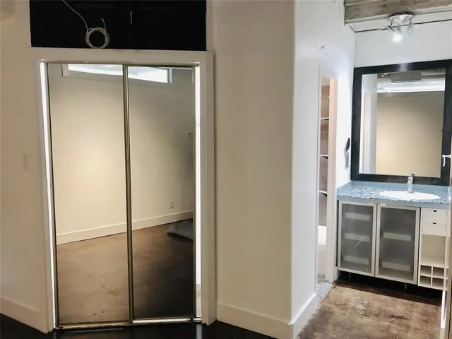 a kitchen with a refrigerator and a sink