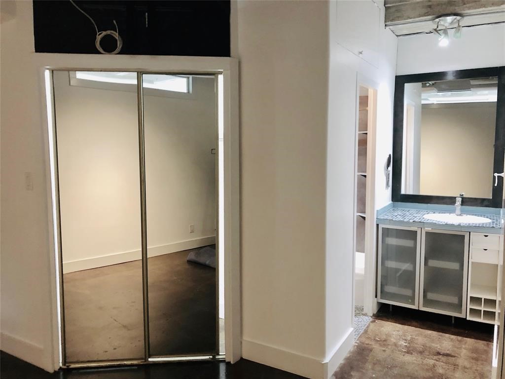 2016 Main Street, Unit 1822 Houston, TX 77002 - Photo 8 of 20 a kitchen with a refrigerator and a sink