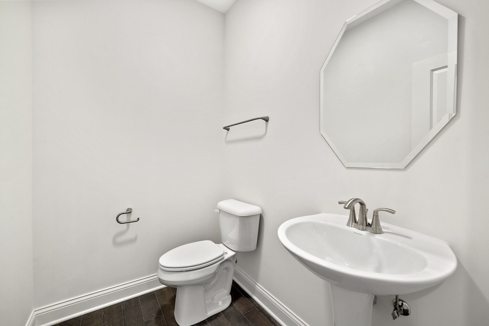 1879 Chandolin Lane Elgin, IL 60124 - Photo 16 of 24 a bathroom with a sink a toilet and a mirror