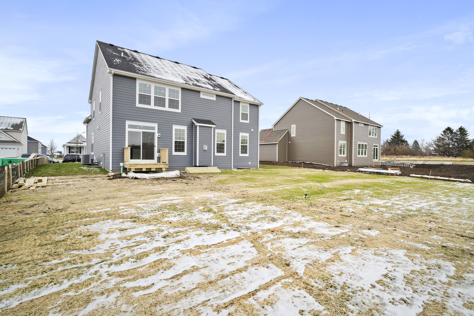 1879 Chandolin Lane Elgin, IL 60124 - Photo 2 of 24 a view of a big house with a swimming pool