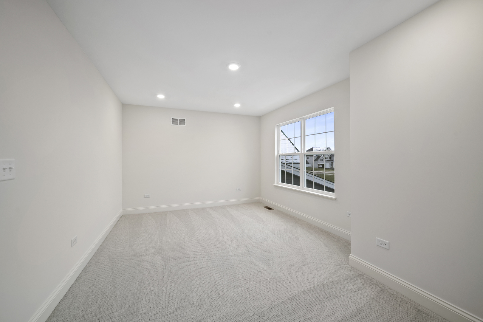 1879 Chandolin Lane Elgin, IL 60124 - Photo 7 of 24 a view of an empty room with a window