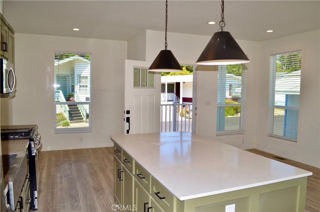 1226 Main Street, Unit 31 Cambria, CA 93428 - Photo 18 of 52 a view of kitchen with furniture and wooden floor