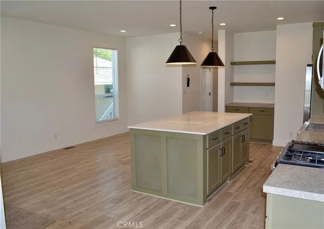 a kitchen with a table and a stove