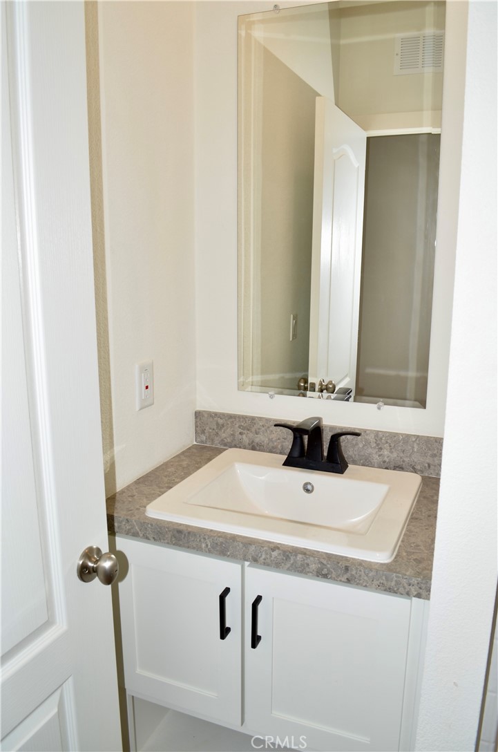 1226 Main Street, Unit 31 Cambria, CA 93428 - Photo 34 of 52 a bathroom with a sink and a mirror