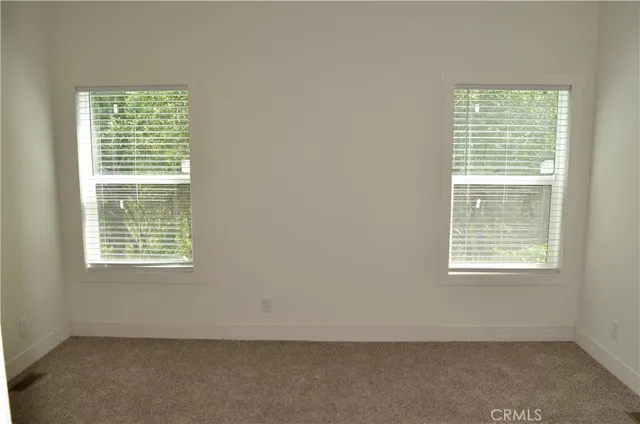 an empty room with closet area