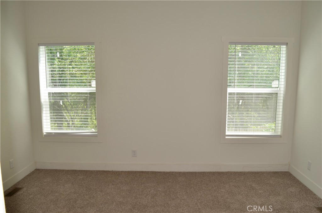1226 Main Street, Unit 31 Cambria, CA 93428 - Photo 39 of 52 an empty room with a window