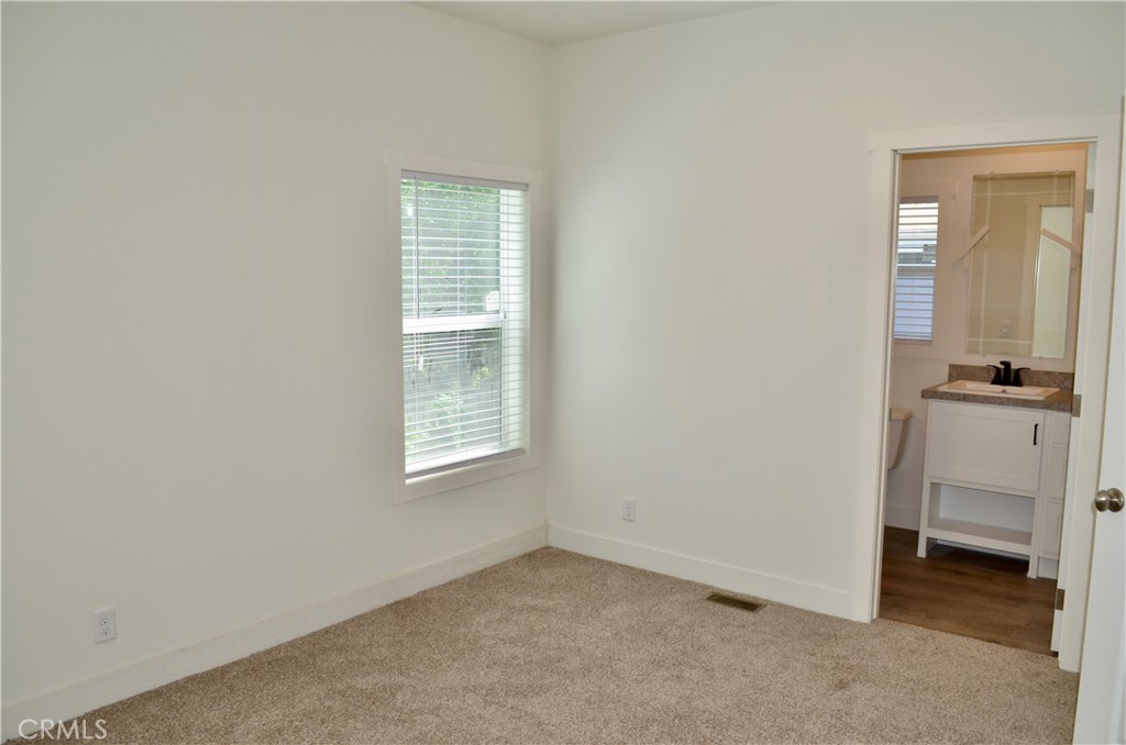 1226 Main Street, Unit 31 Cambria, CA 93428 - Photo 40 of 52 an empty room with a window