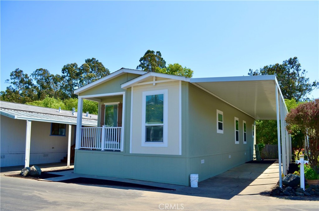 1226 Main Street, Unit 31 Cambria, CA 93428 - Photo 4 of 52 a front view of a house with a yard