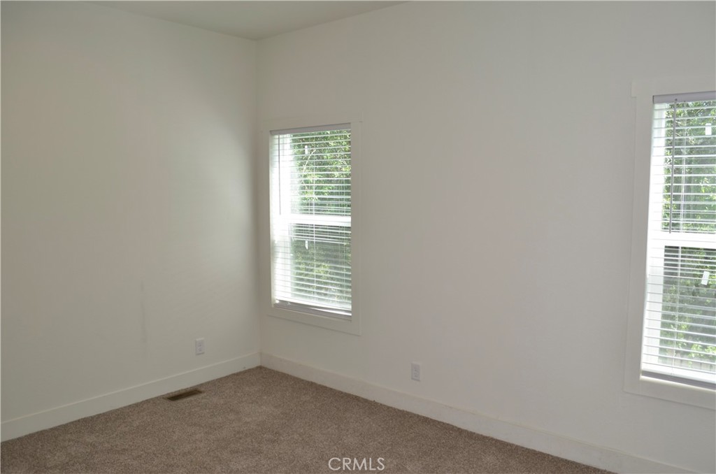 1226 Main Street, Unit 31 Cambria, CA 93428 - Photo 43 of 52 an empty room with a window