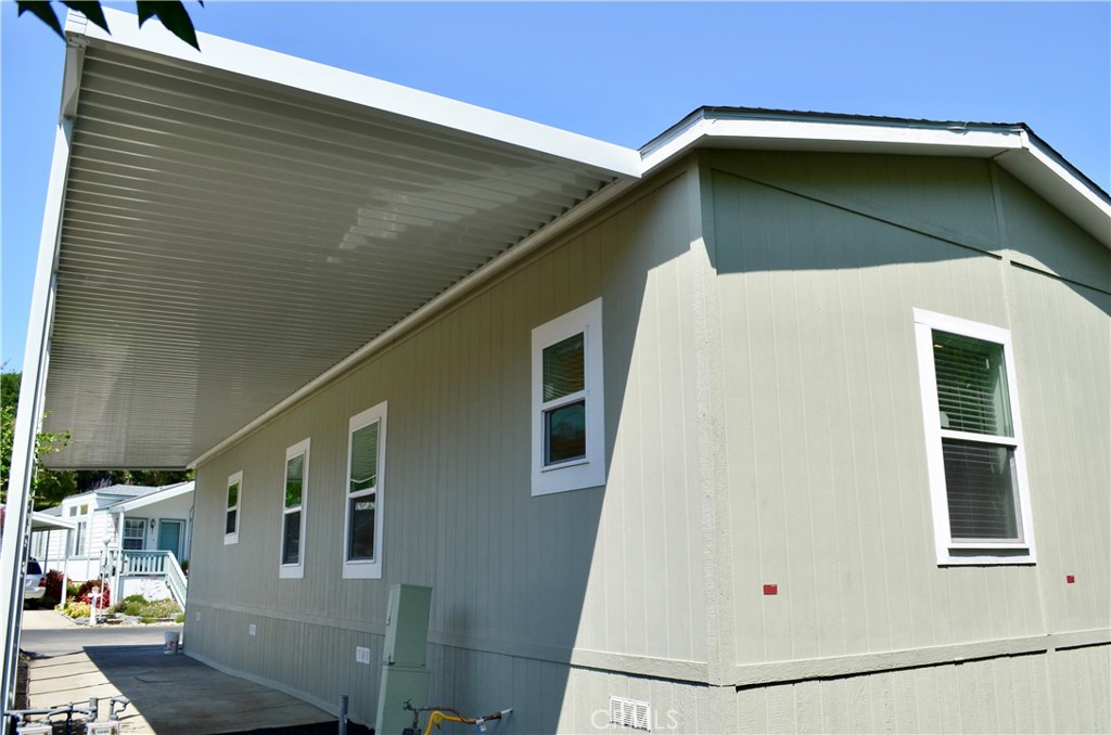 1226 Main Street, Unit 31 Cambria, CA 93428 - Photo 10 of 52 a house with a door and windows
