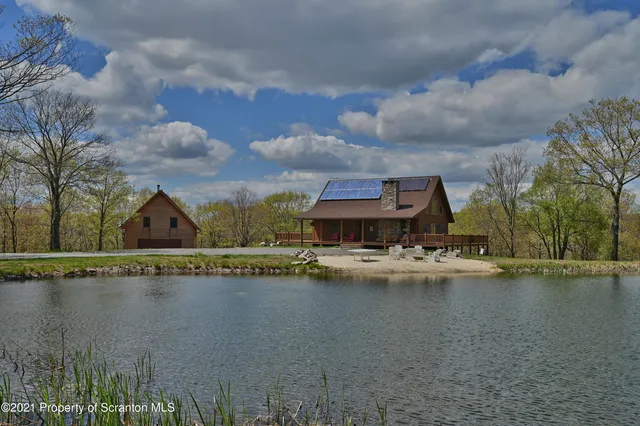 a view of a lake with houses in the back