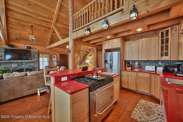 a kitchen with stainless steel appliances granite countertop a stove and a sink