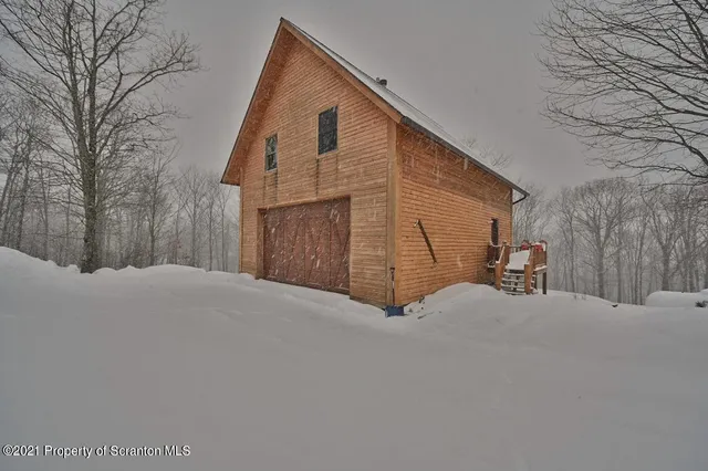 a view of a house with a yard and garage