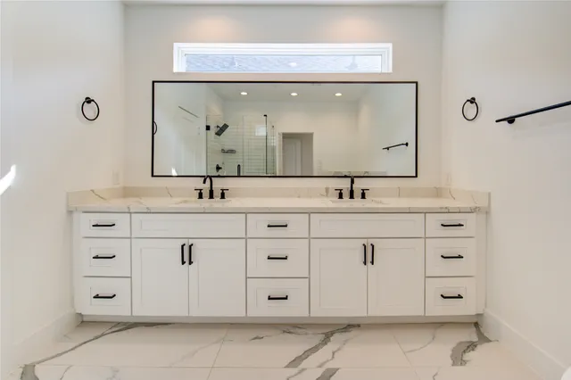 a bathroom with a bathtub and shower