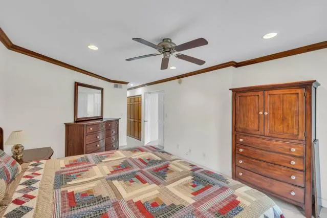 a bed room with a bed and a mirror