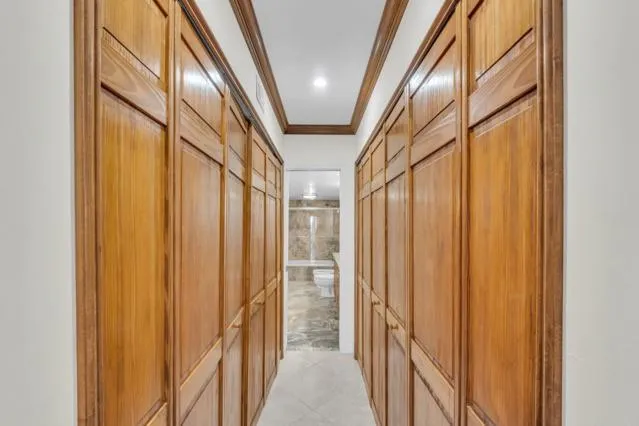 a bathroom with a granite countertop sink a mirror and a bathtub