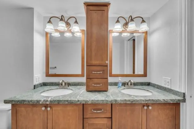 a bathroom with a shower and a sink