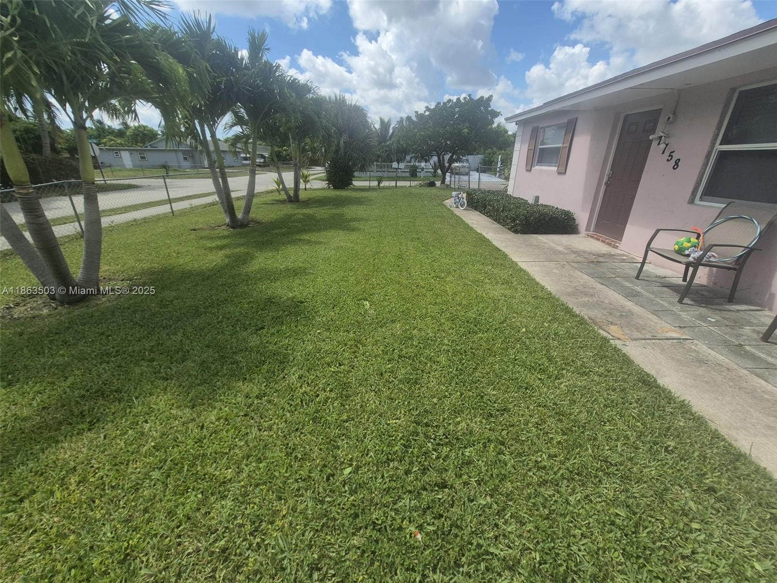 7756 Washington Avenue, Unit 7758 Lake Worth, FL 33462 - Photo 1 of 15 a view of a backyard
