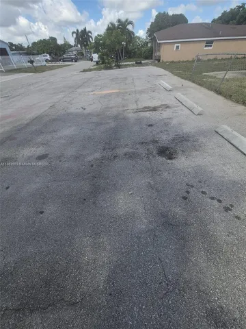 a view of a big yard with an empty space