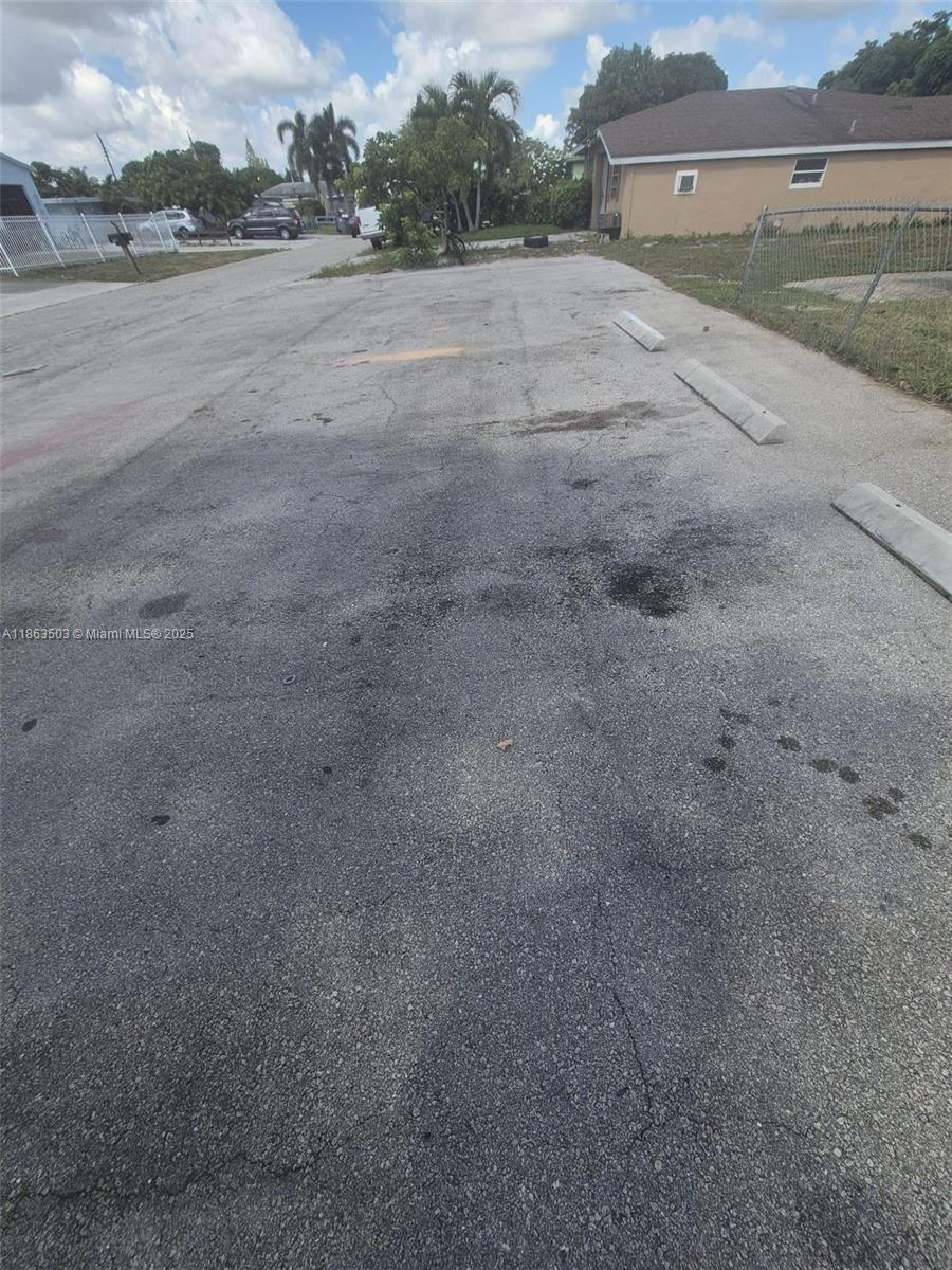 7756 Washington Avenue, Unit 7758 Lake Worth, FL 33462 - Photo 15 of 15 a view of a big yard with an empty space
