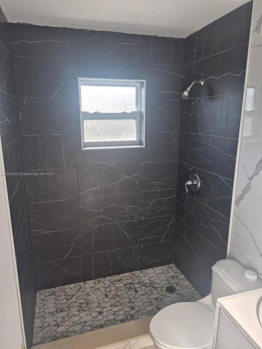 7756 Washington Avenue, Unit 7758 Lake Worth, FL 33462 - Photo 8 of 15 a bathroom with a shower