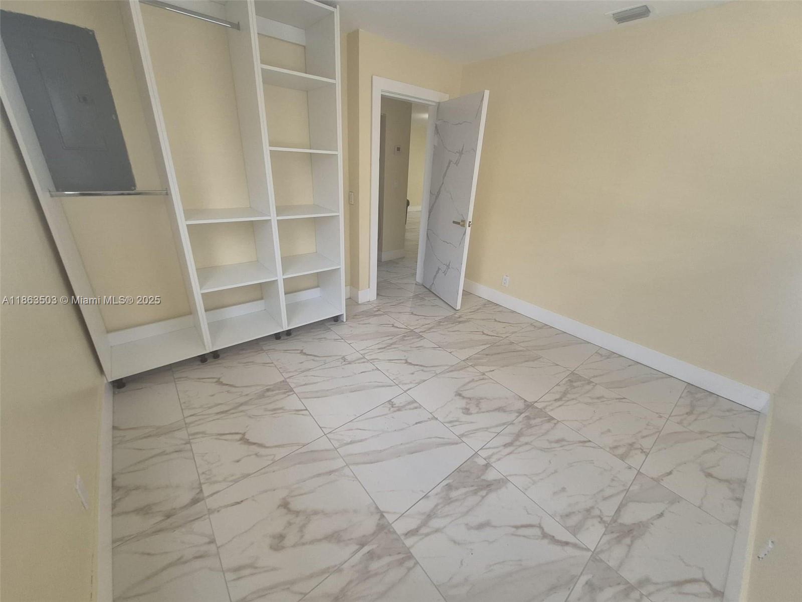 7756 Washington Avenue, Unit 7758 Lake Worth, FL 33462 - Photo 9 of 15 a view of an empty room with a sink and a window