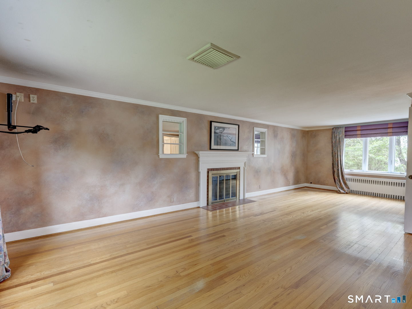 501 Highland Street Wethersfield, CT 06109 - Photo 17 of 38 a view of empty room with wooden floor and fan