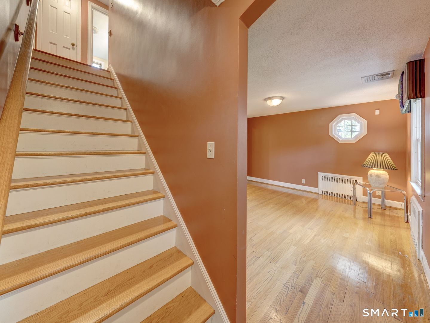 501 Highland Street Wethersfield, CT 06109 - Photo 23 of 38 a view of entryway and hall with wooden floor