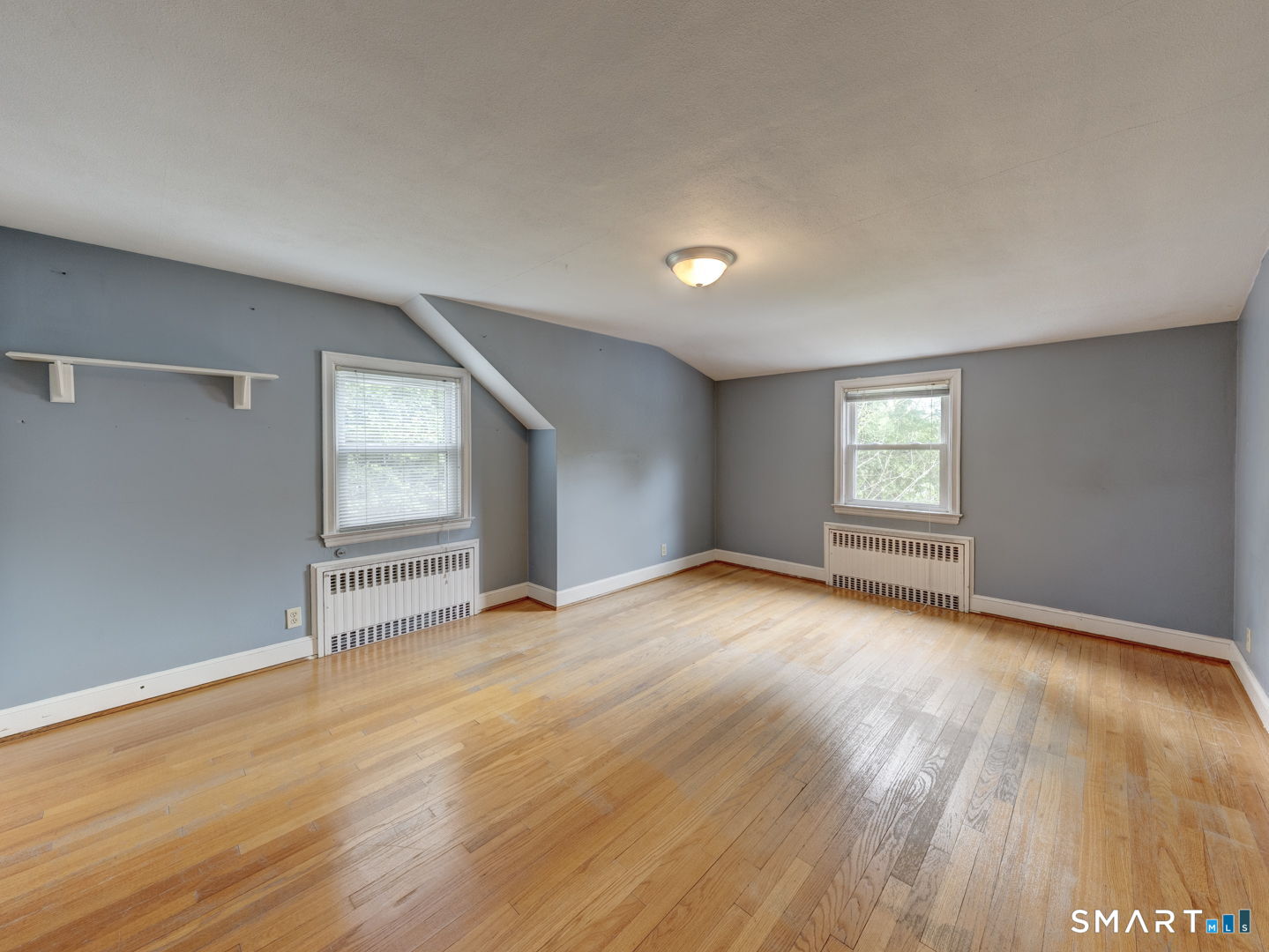 501 Highland Street Wethersfield, CT 06109 - Photo 25 of 38 an empty room with wooden floor and windows