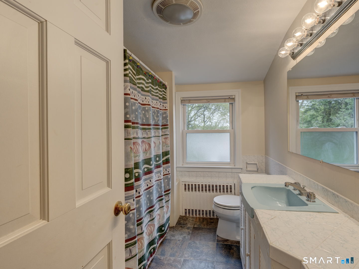 501 Highland Street Wethersfield, CT 06109 - Photo 26 of 38 a bathroom with a sink a toilet and shower