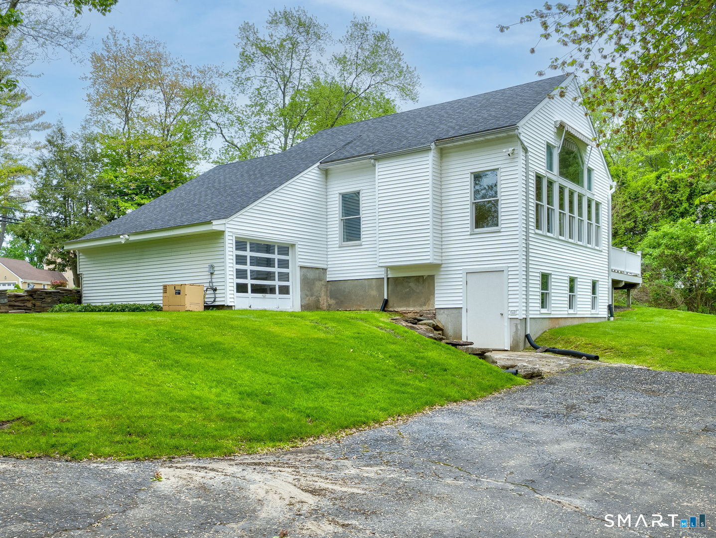 501 Highland Street Wethersfield, CT 06109 - Photo 34 of 38 a view of a house with a yard and a garden