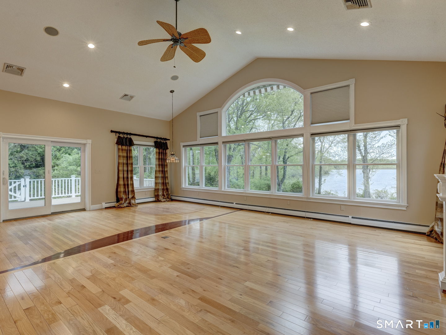 501 Highland Street Wethersfield, CT 06109 - Photo 5 of 38 a view of an empty room with a window and wooden floor