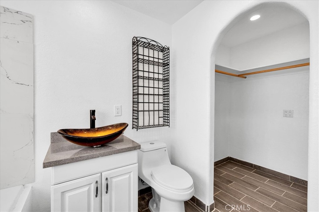 57726 Starlight Mesa Road Yucca Valley, CA 92284 - Photo 15 of 75 a bath room with a toilet