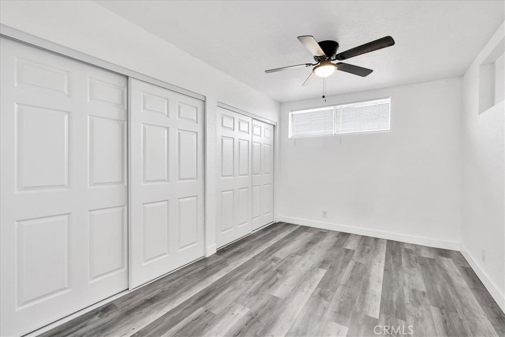 57726 Starlight Mesa Road Yucca Valley, CA 92284 - Photo 16 of 75 wooden floor in an empty room