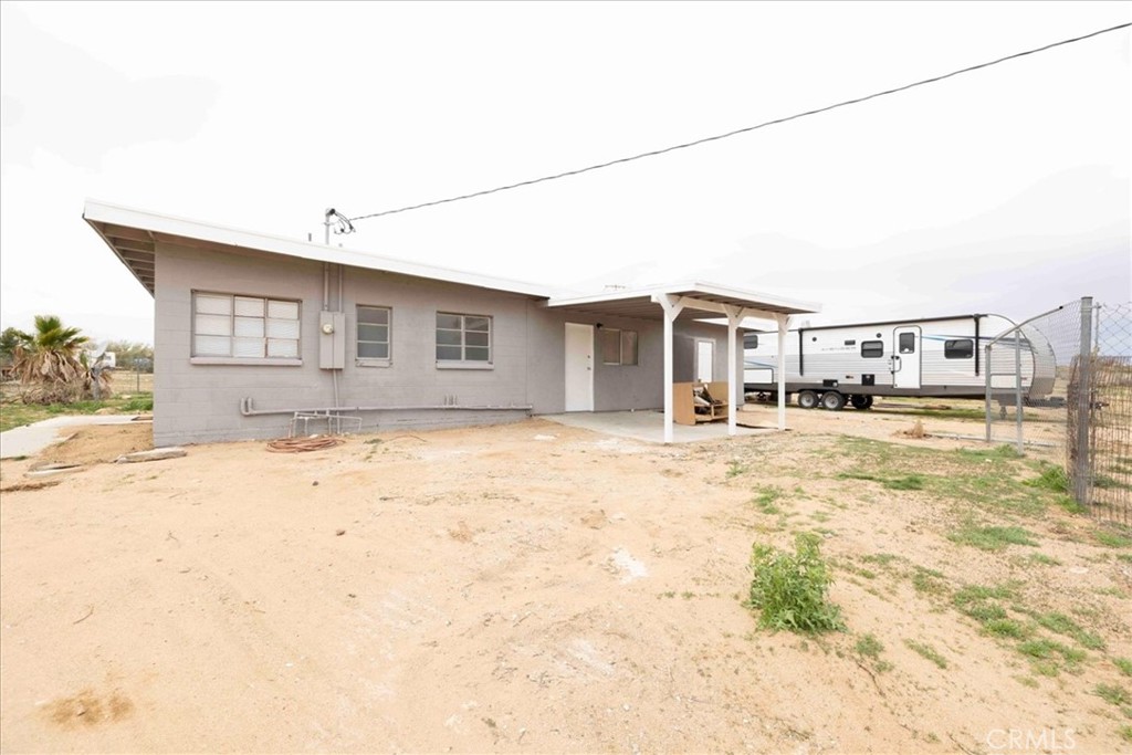 57726 Starlight Mesa Road Yucca Valley, CA 92284 - Photo 52 of 75 a front view of a house with a yard