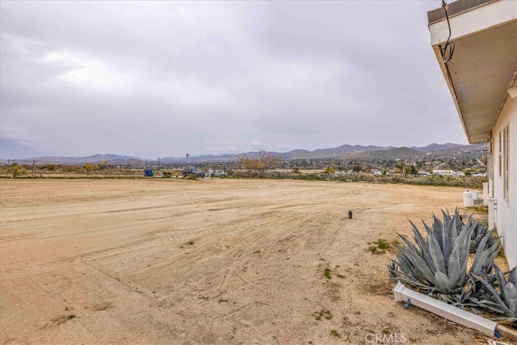 57726 Starlight Mesa Road Yucca Valley, CA 92284 - Photo 57 of 75 a view of a lake with a mountain in the background