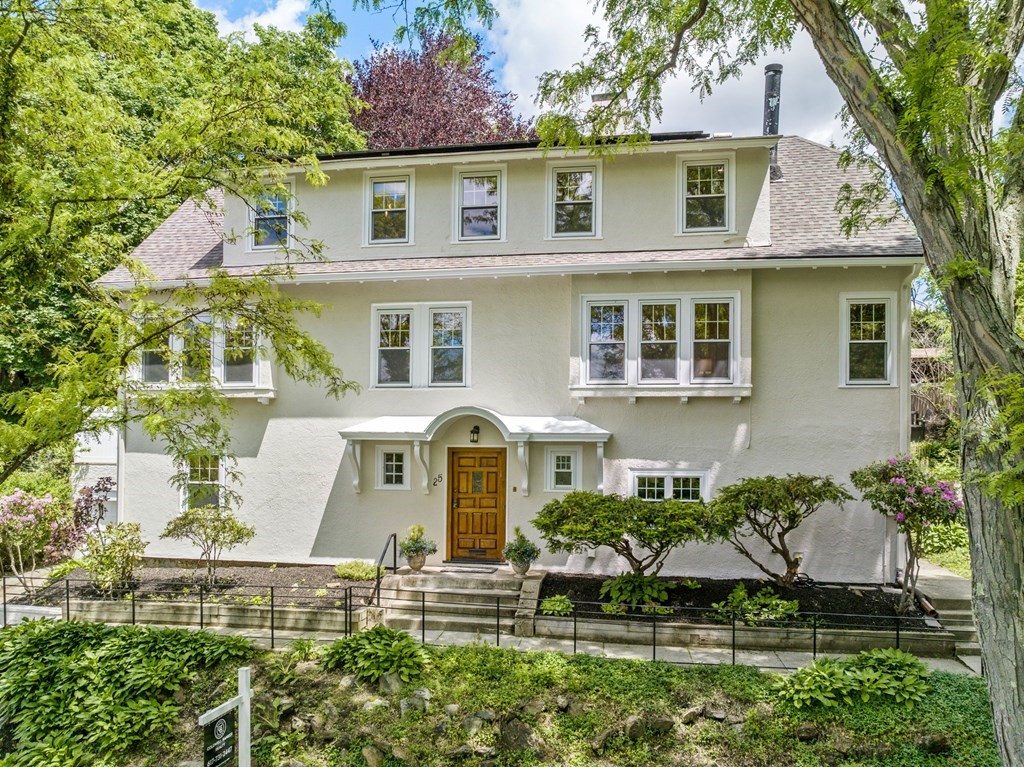 front view of a house with a yard