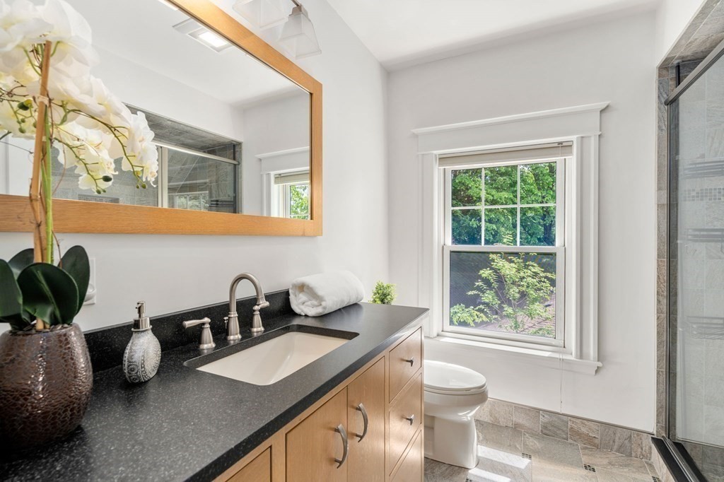 25 Windsor Road Brookline, MA 02445 - Photo 14 of 31 a kitchen with a sink a counter and a window