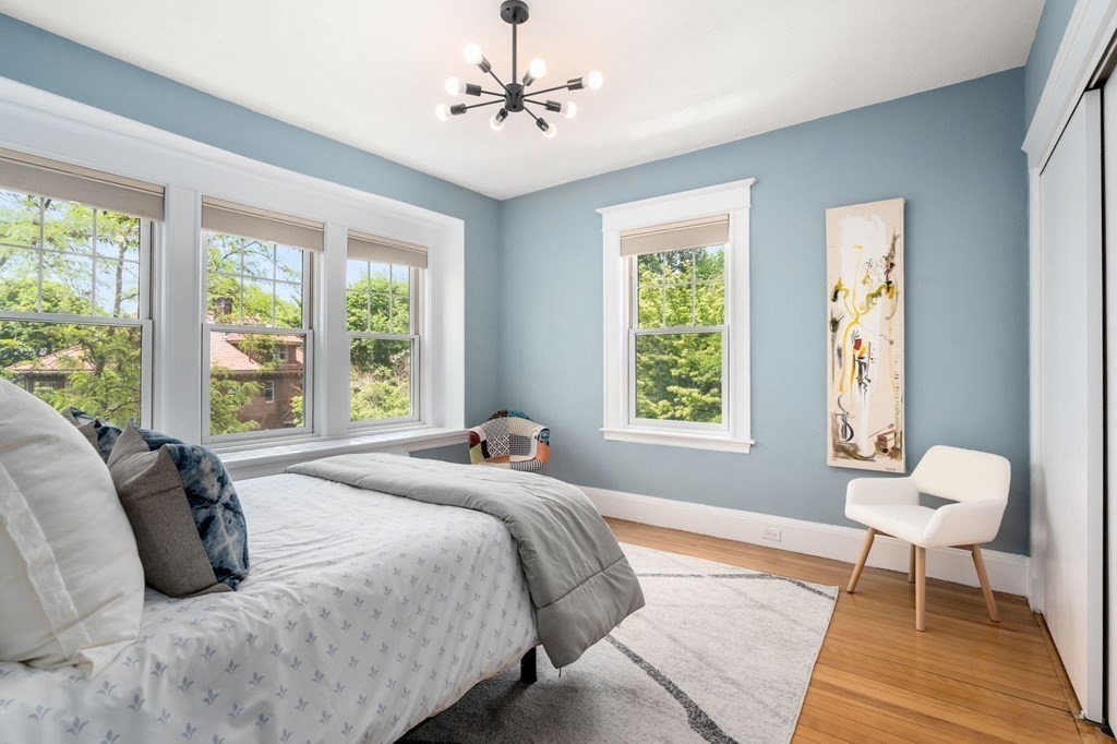 25 Windsor Road Brookline, MA 02445 - Photo 17 of 31 a bed sitting in a bedroom next to a window