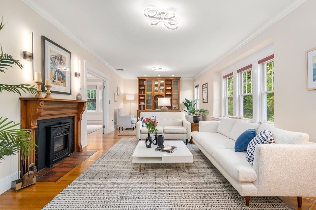 25 Windsor Road Brookline, MA 02445 - Photo 2 of 31 a living room with furniture and a fireplace