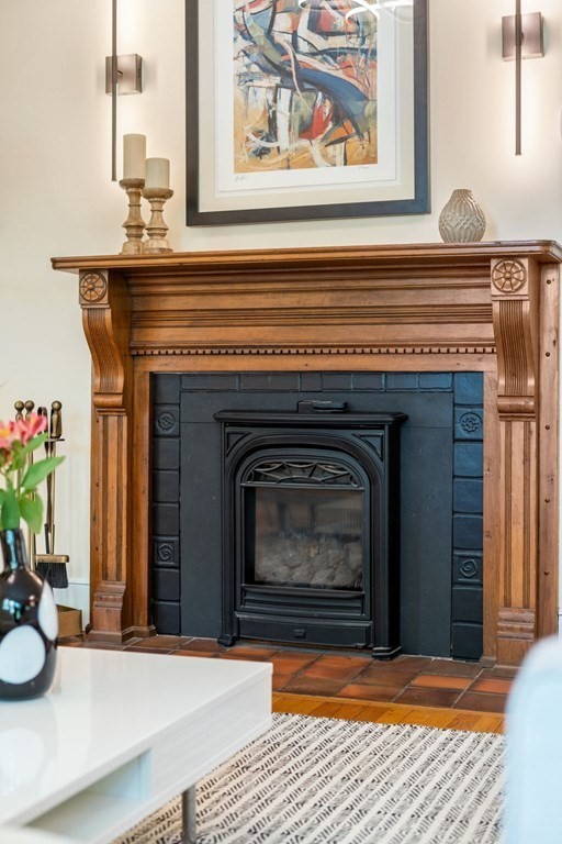 25 Windsor Road Brookline, MA 02445 - Photo 5 of 31 a view of a fireplace with furniture and a fireplace